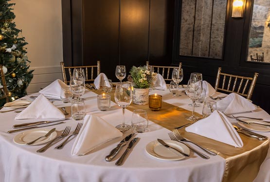 A dining table set up for a holiday party.