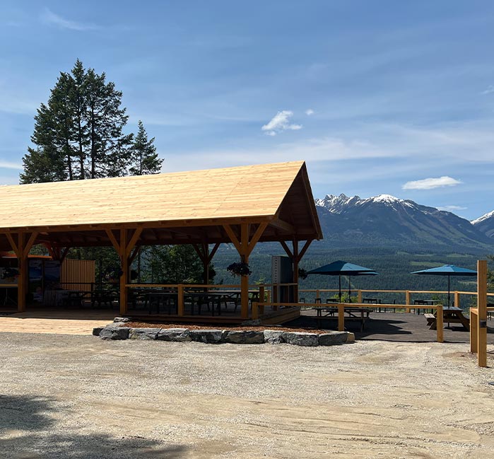 A wooden pavilion at a valley viewpoint.