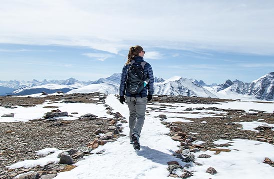 Person snowshoeing on a mountain in Jasper