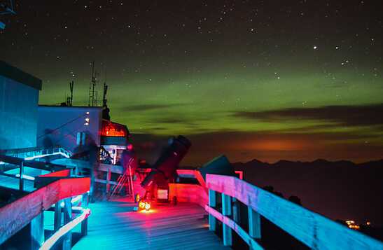 The Jasper SkyTram boardwalk lit up for stargazing at night.