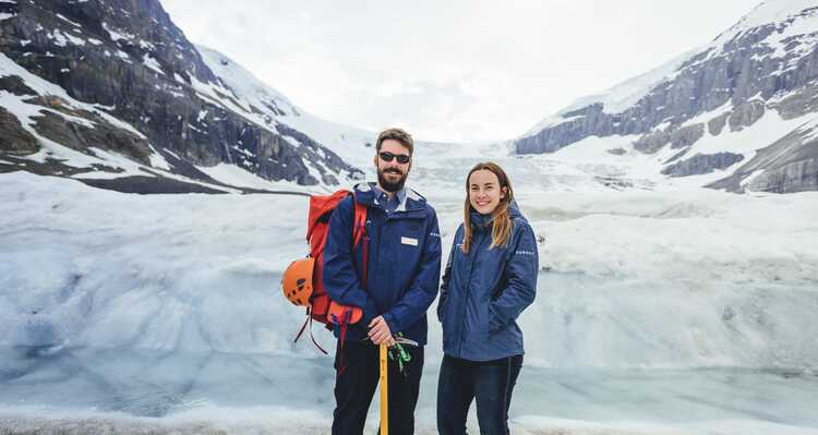 A couple standing in front of a Glacier